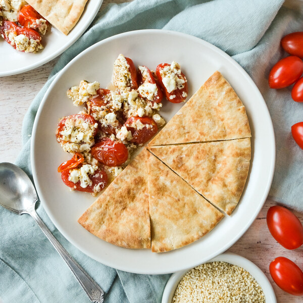 Garlicky Roasted Tomatoes with Feta, Sesame Seeds & Pita Bread