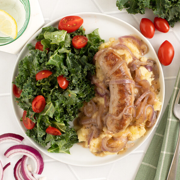 British-Style Sausage with Mashed Potatoes, Onion Gravy & Kale Salad