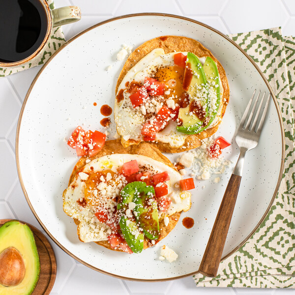 Fried Egg Breakfast Tostadas with Tomato, Avocado, Feta & Hot Sauce