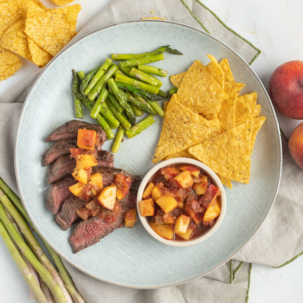 Strip Steak with Peach Salsa, Sautéed Asparagus & Tortilla Chips