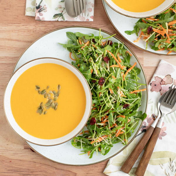 Butternut Squash Soup with Arugula, Cranberry & Pumpkin Seed Salad