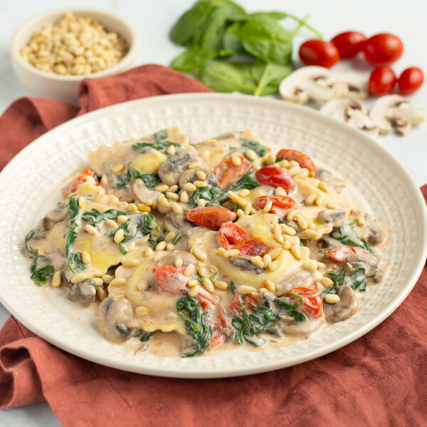Creamy Tuscan Ravioli with Mushrooms, Tomatoes, Spinach & Pine Nuts