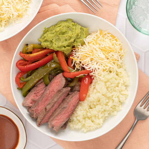 Cauliflower Rice Burrito Bowl with Steak, Peppers, Guacamole & Cheese