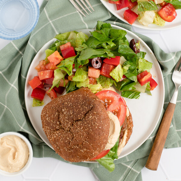 Hummus Veggie Burger with Tomato, Olive & Romaine Salad