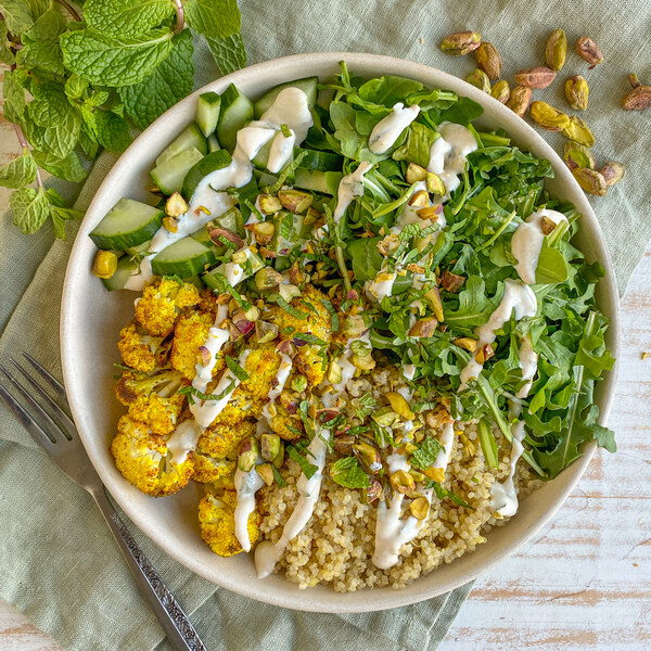 Curried Cauliflower Quinoa Bowl with Arugula, Pistachios & Mint