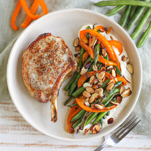 Broiled Pork Chop with Green Beans, Peppers, Tahini Yogurt & Almonds